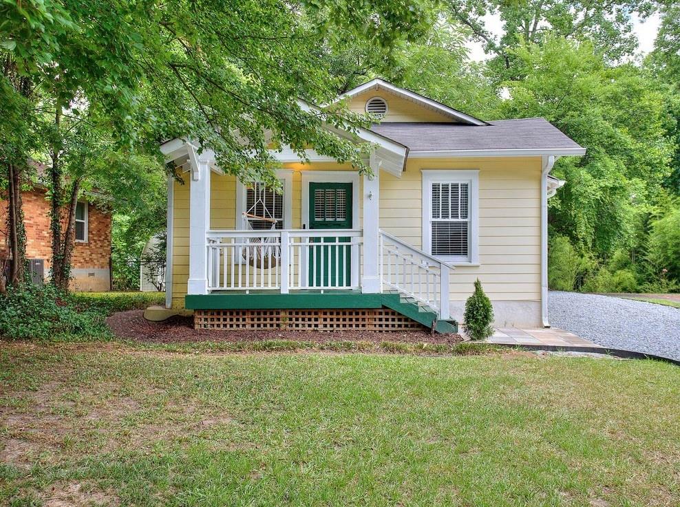 a view of a house with a yard