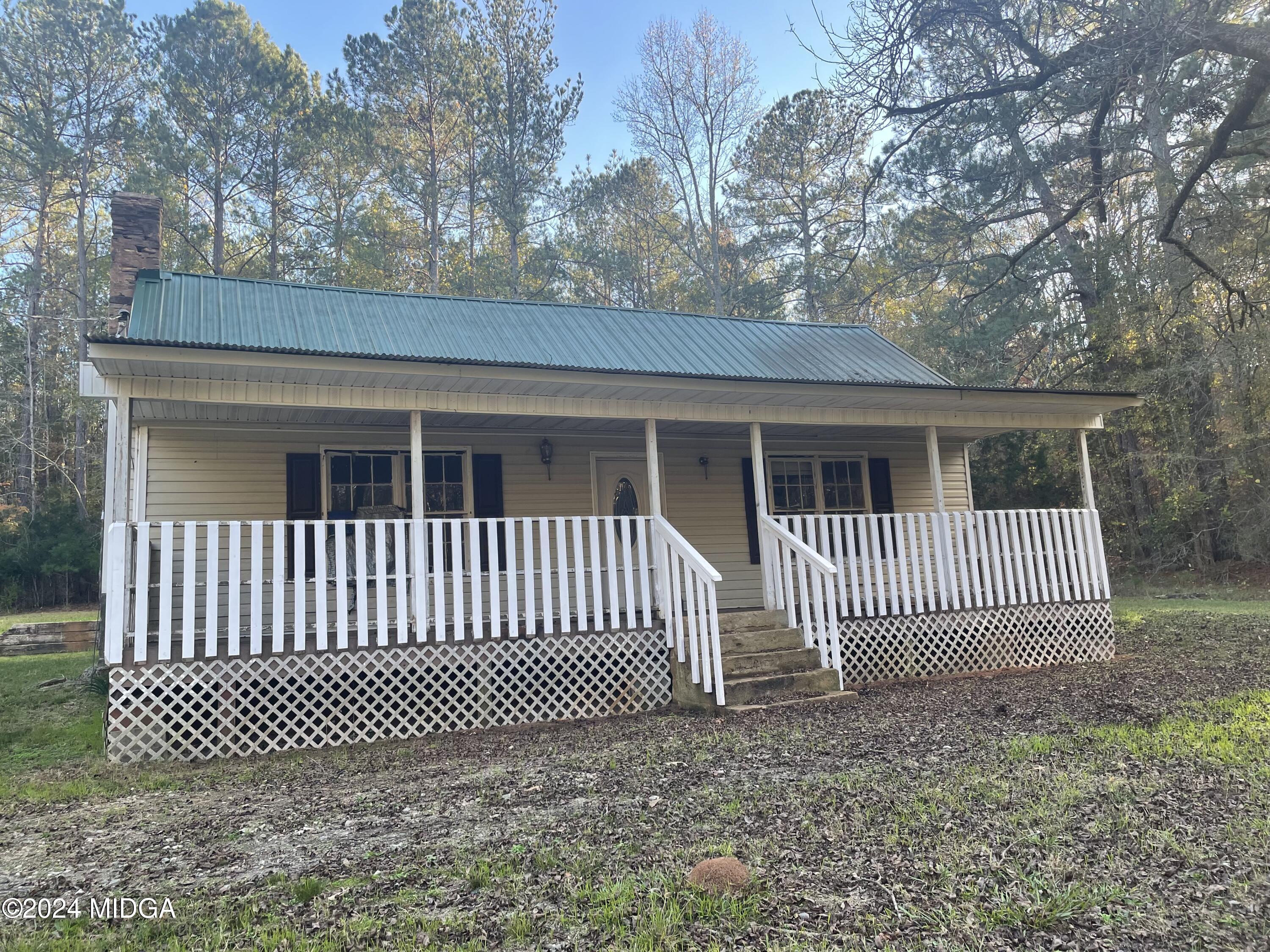 a view of a house with a gate