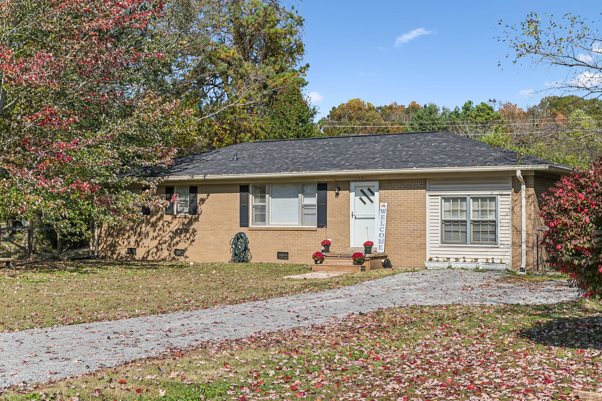 a front view of a house with a yard