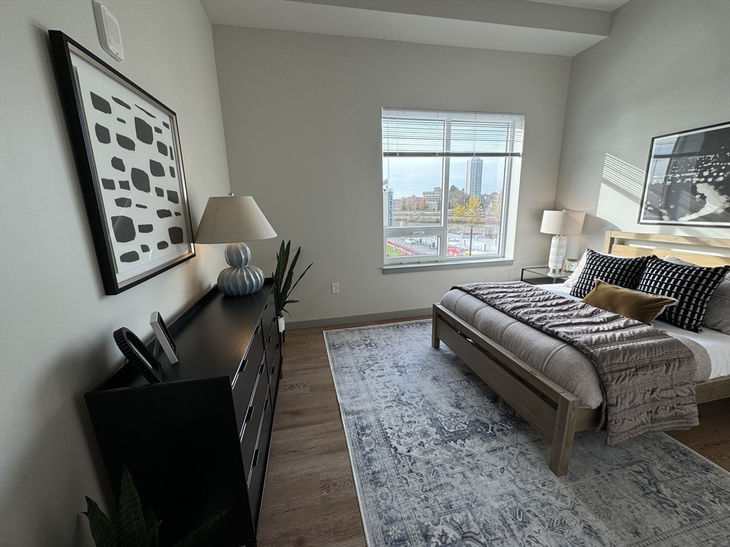 a bedroom with furniture and a window