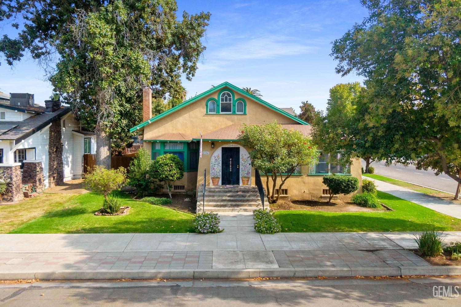 a front view of house with yard and green space