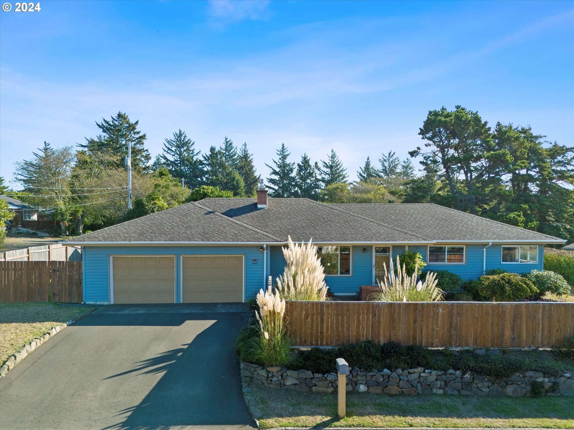 front view of a house with a yard