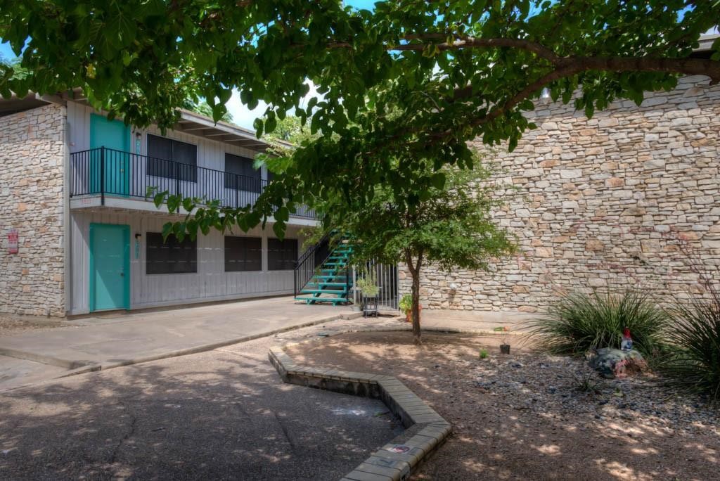 a view of a house with a tree and a tree