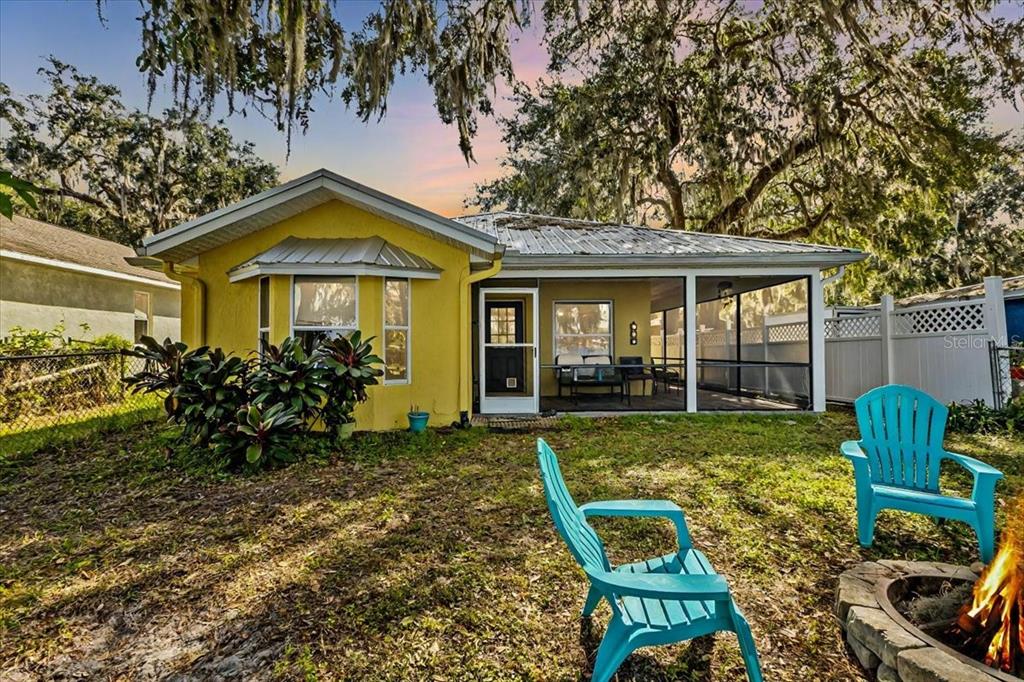 a view of an house with backyard space and garden