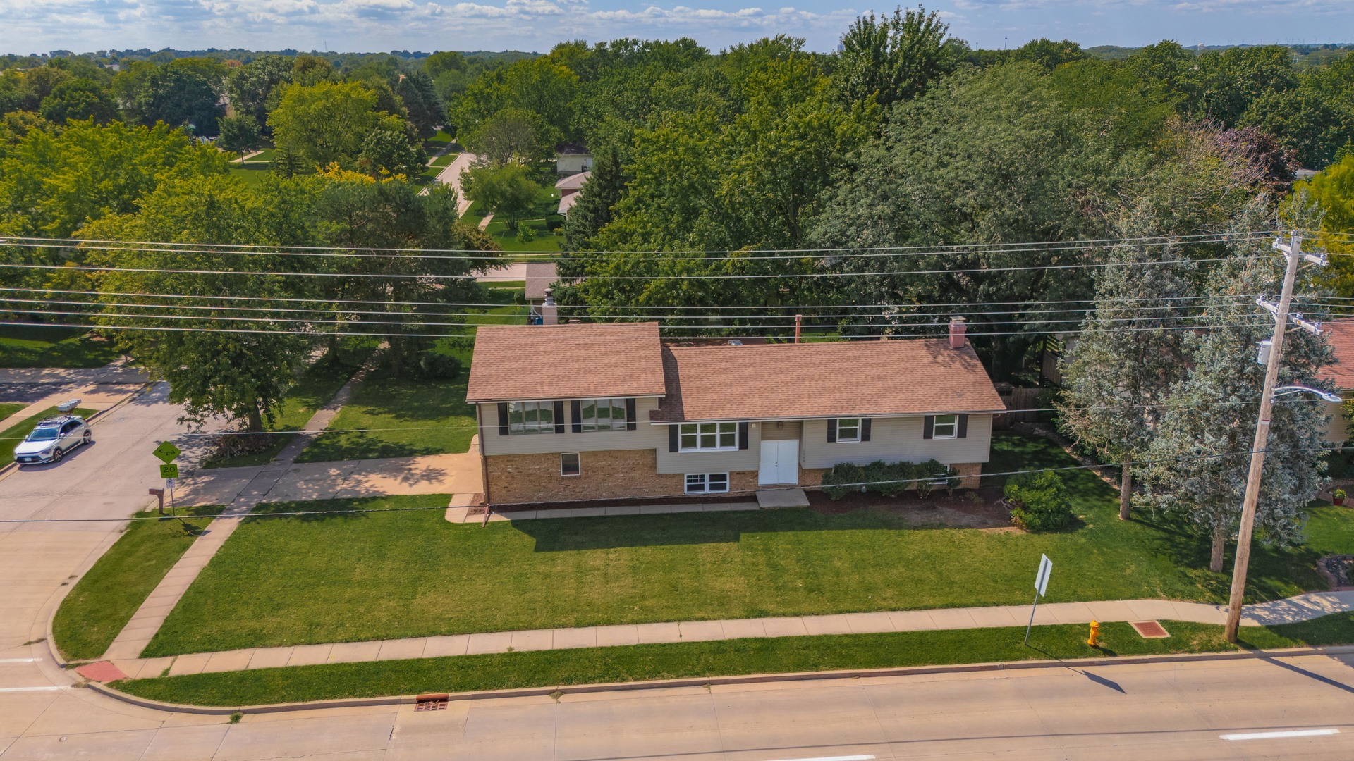 a aerial view of a house with a yard