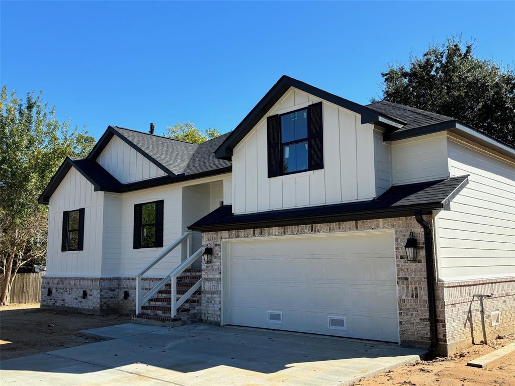 a front view of a house with a garage