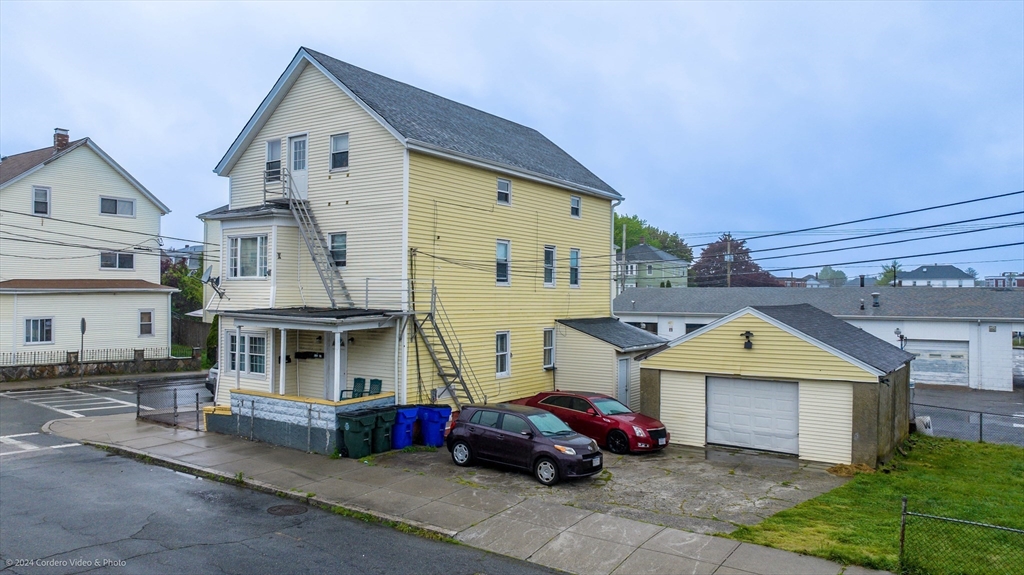 a front view of a house with parking space