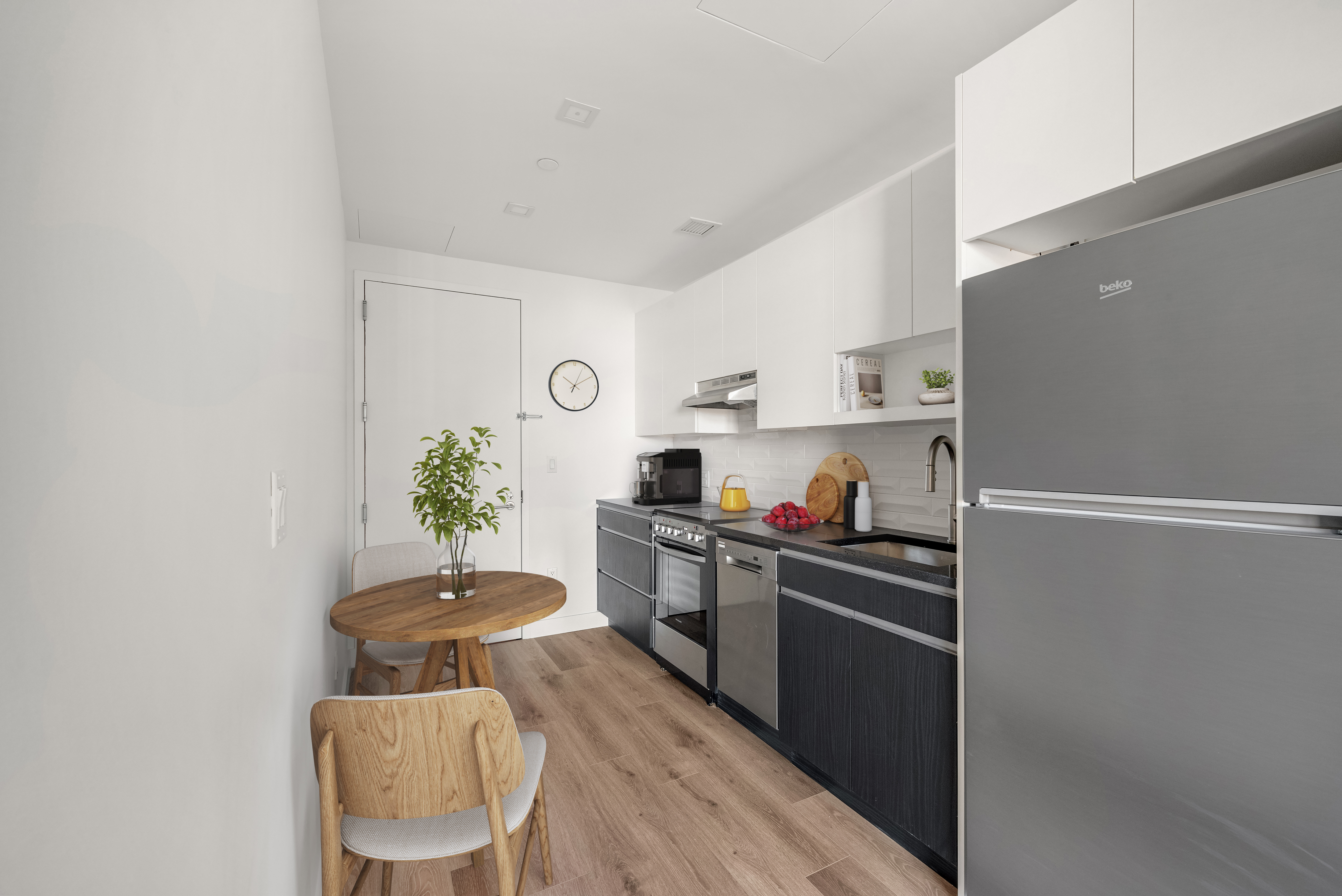 a kitchen with a refrigerator and a stove