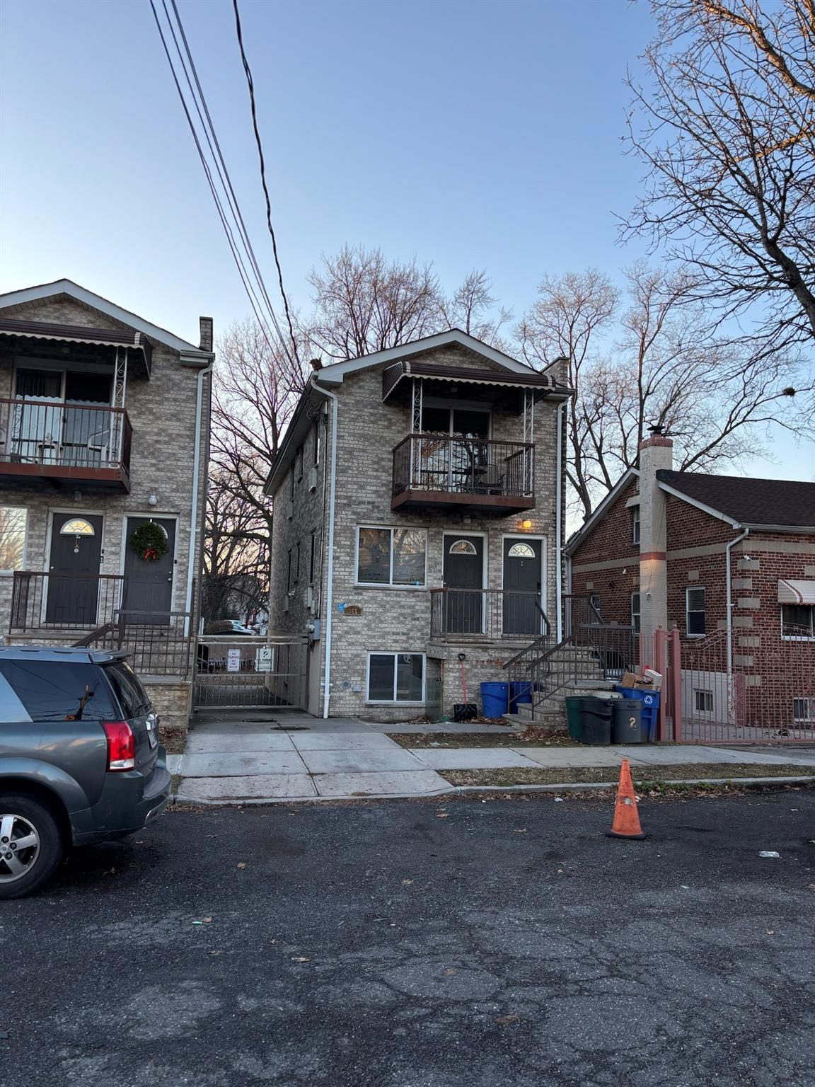 View of front of property with a balcony