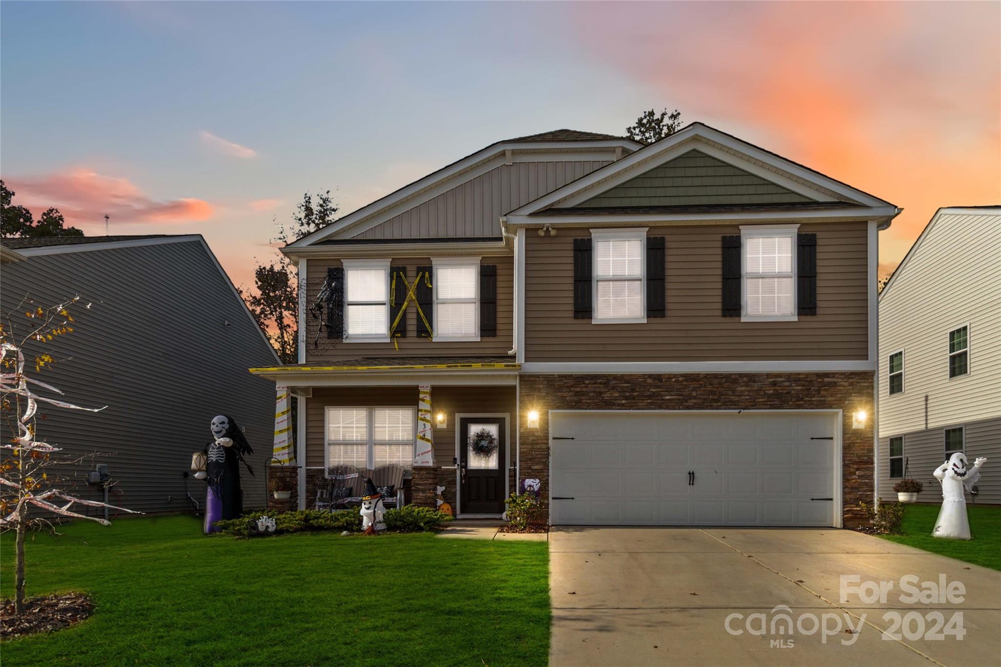 a front view of a house with a yard