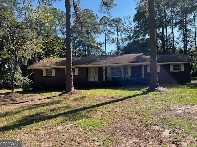 a view of a house with a yard