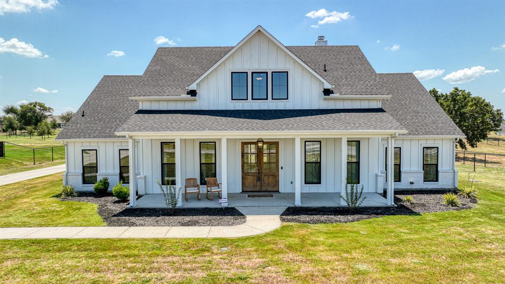 a view of a house with swimming pool and porch