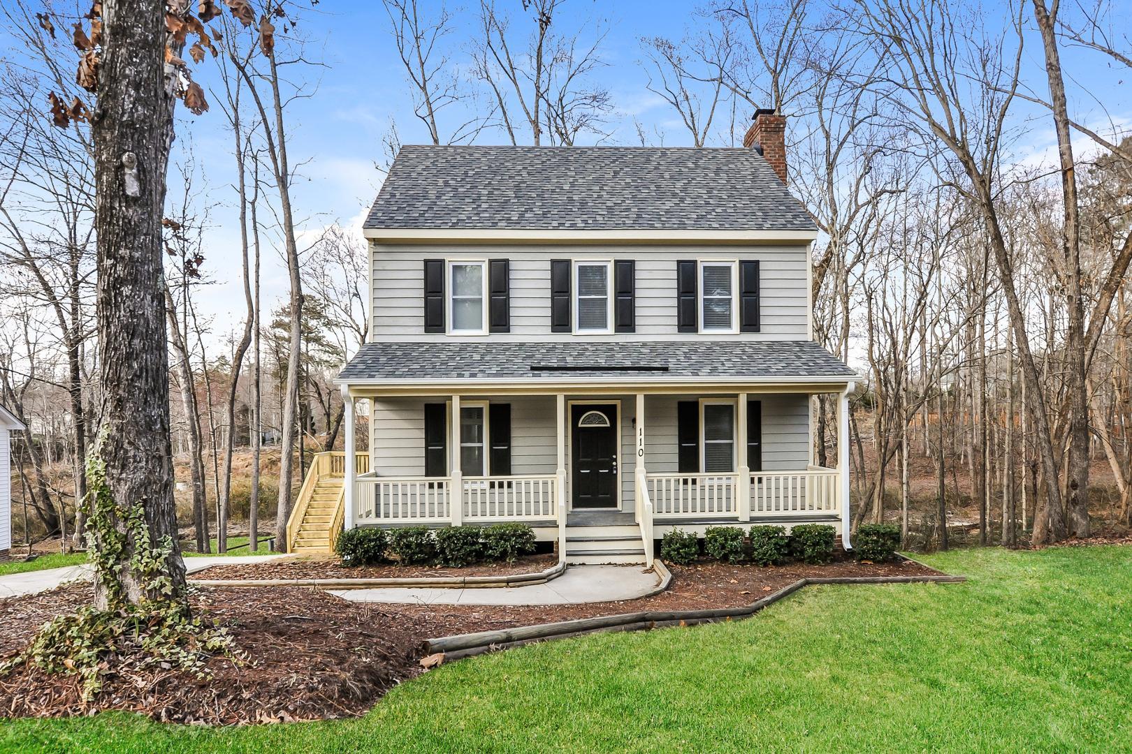 front view of a house with a yard