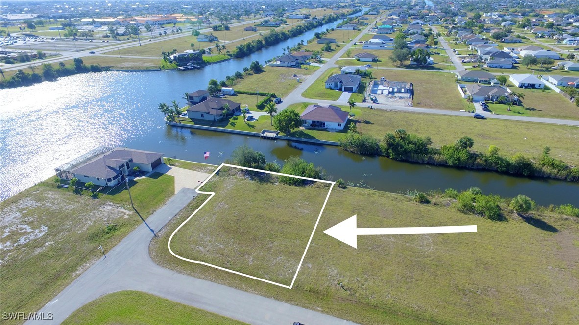 an aerial view of a house with a lake view