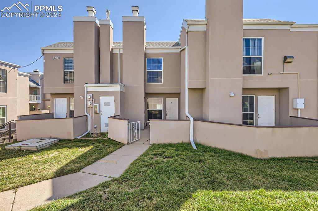 front view of a house with a yard