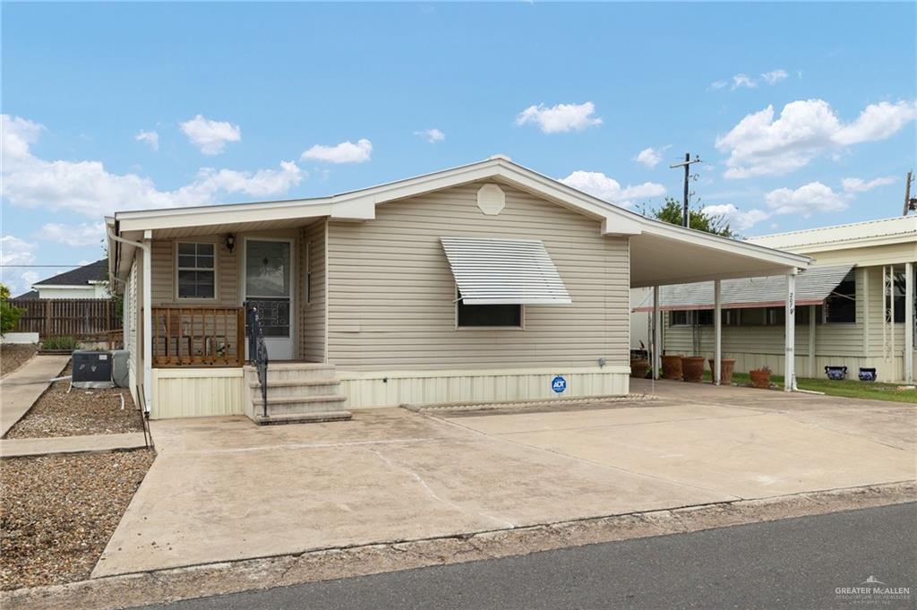 a front view of a house with a garden and garage