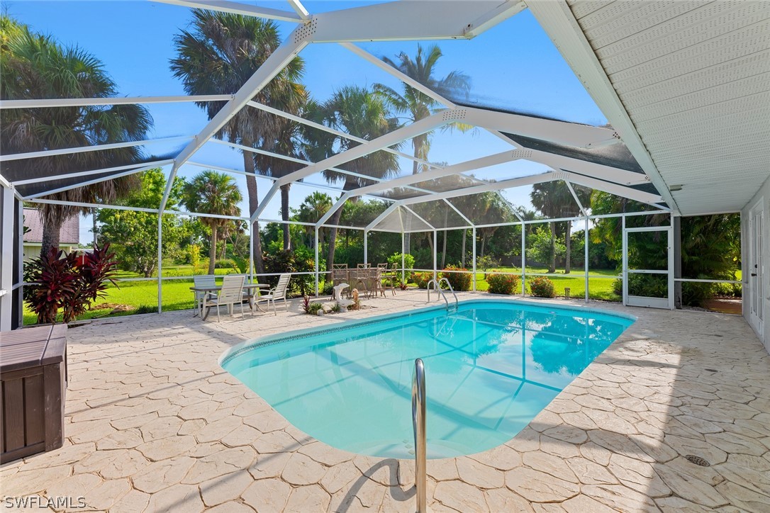 a view of a swimming pool with sitting area