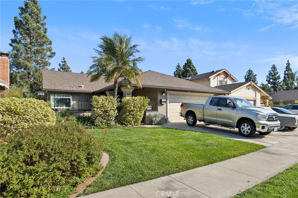 a view of a car parked in front of a house