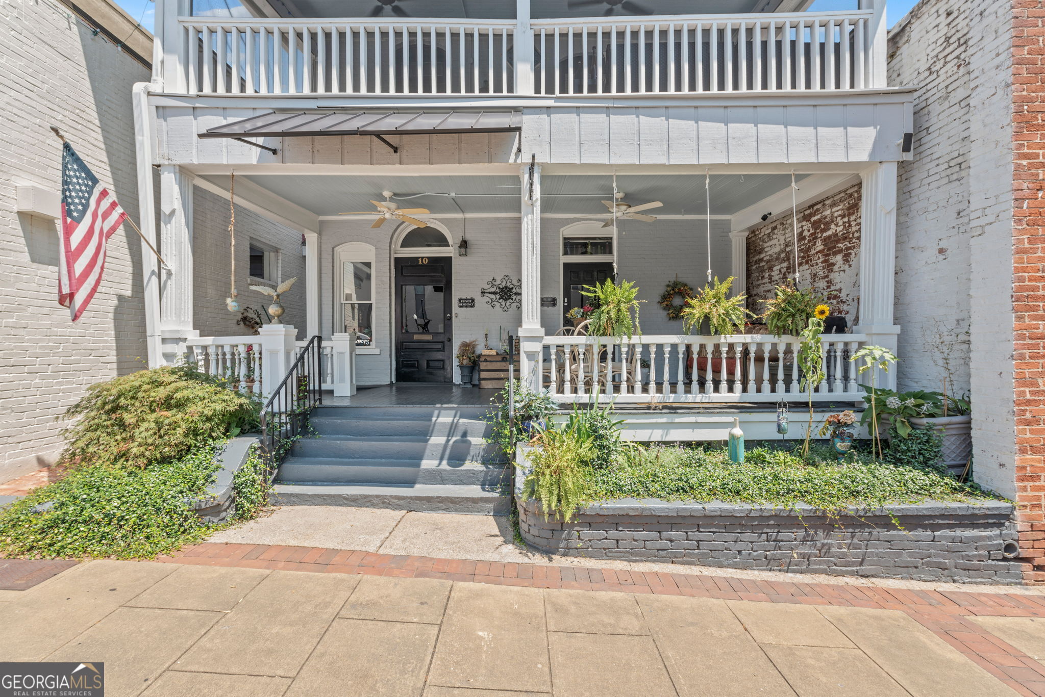 a front view of a house with a porch