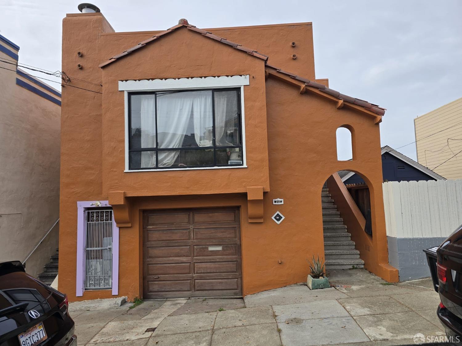 a front view of a house with stairs