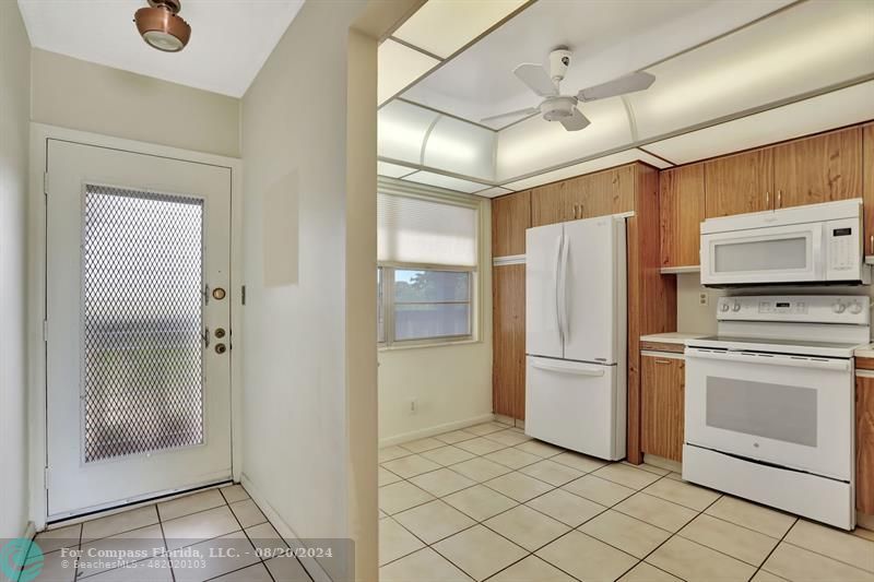 a bathroom with a refrigerator and a sink