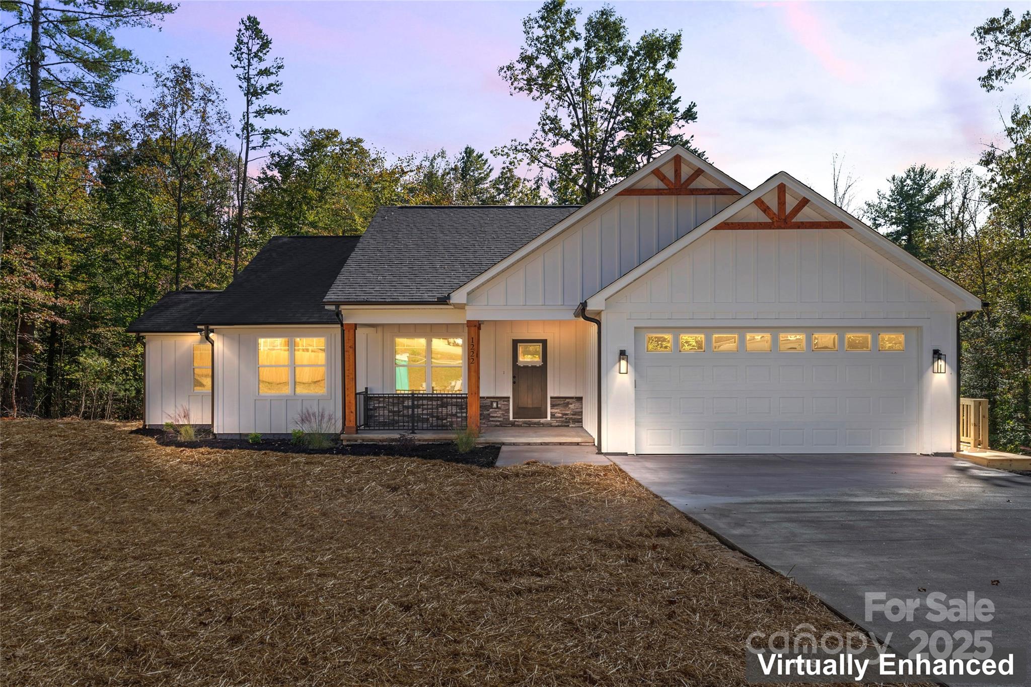 a view of a house with a yard and garage