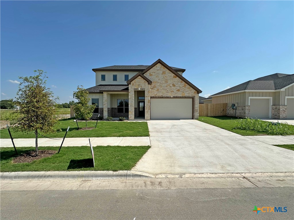 a house with yard in front of it