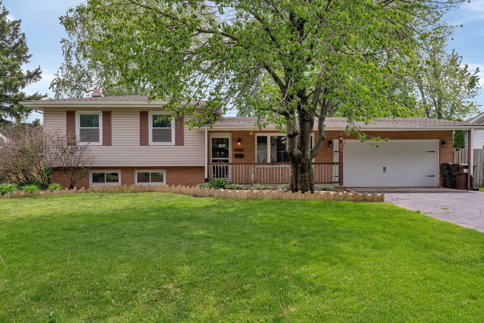 front view of a house with a yard