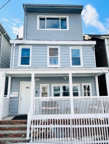 a front view of a house with a porch