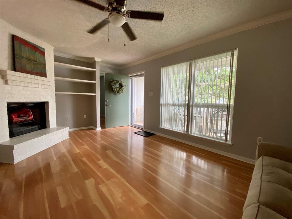 Spacious living room with beautiful wood-look vinyl flooring is light and bright with NEW double pane vinyl windows.