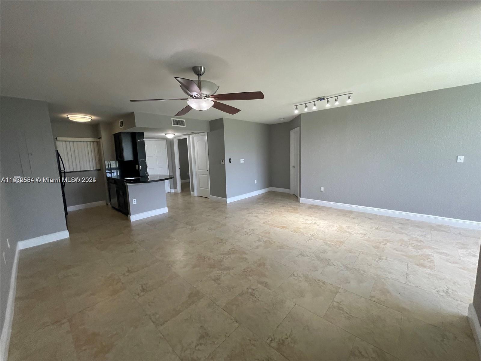 a view of a livingroom with a kitchen