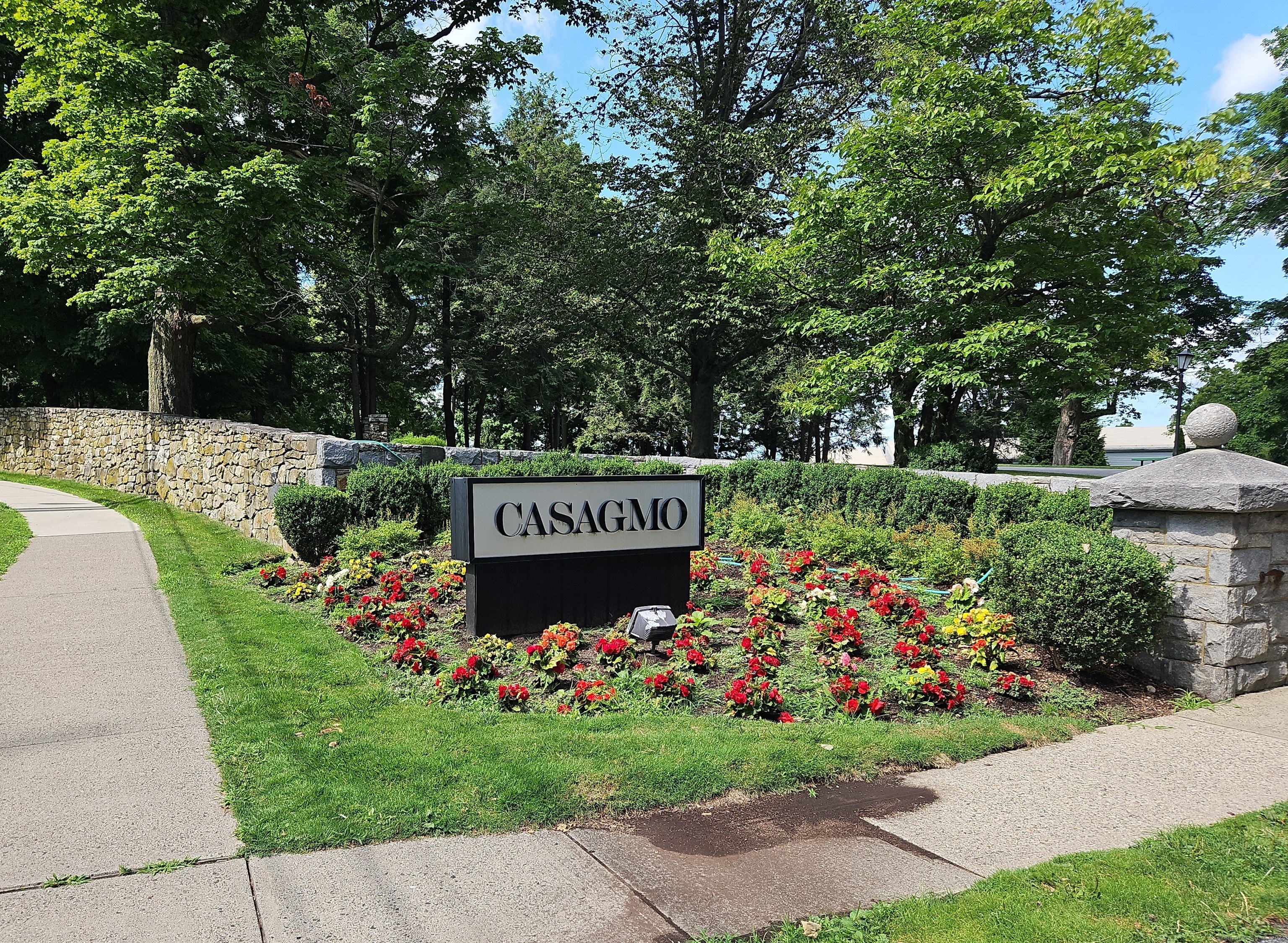 a view of sign board with garden