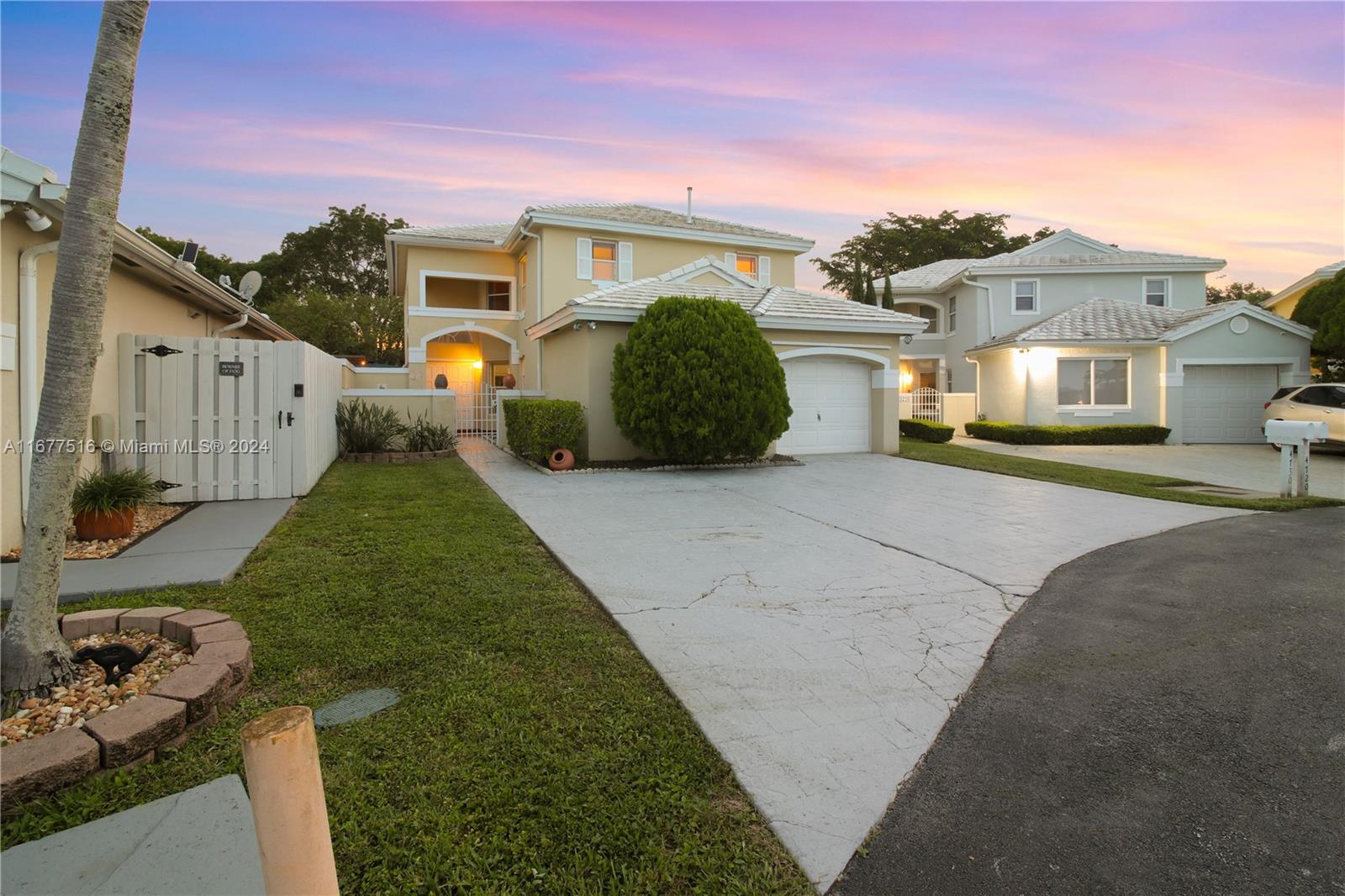 a view of a front view of a house with a yard