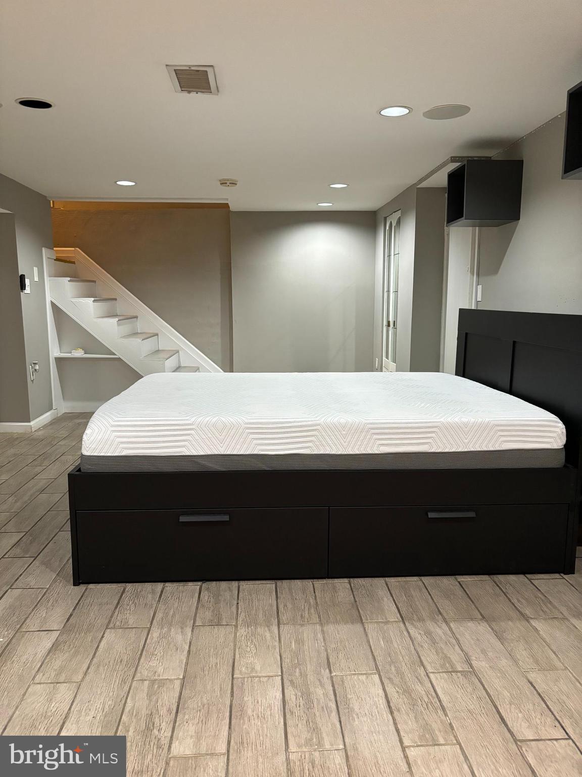 a bathroom with a sink vanity and a mirror