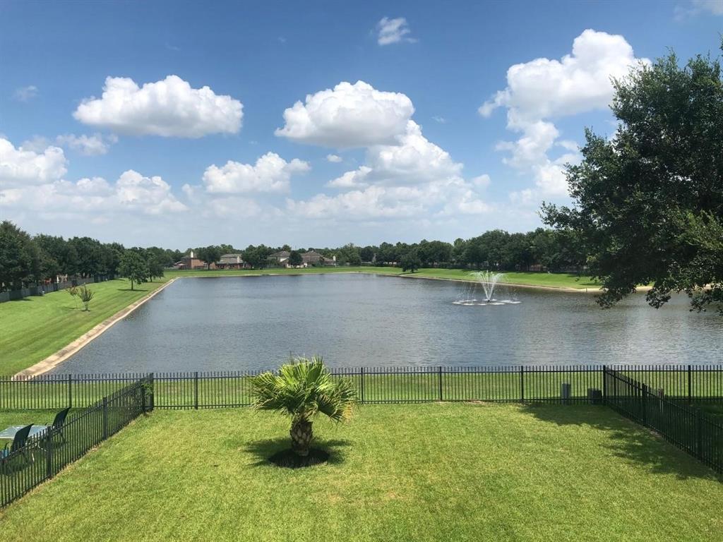 a view of a lake with a yard