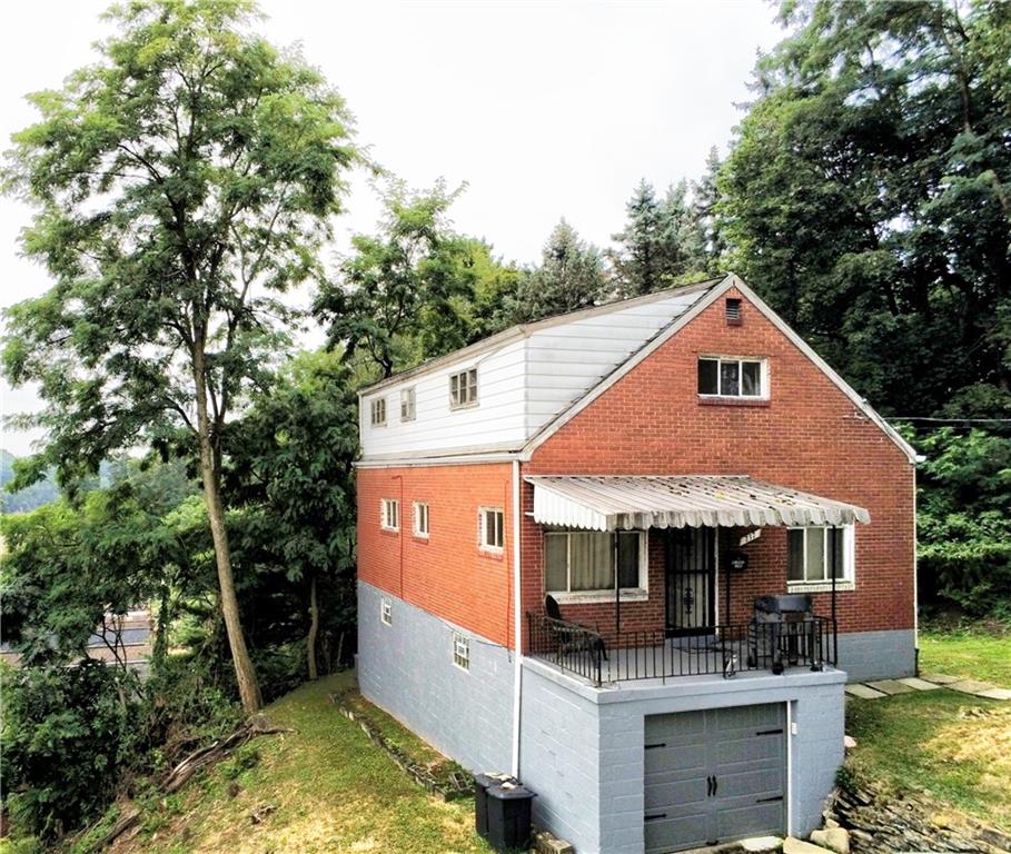 a view of house with outdoor seating