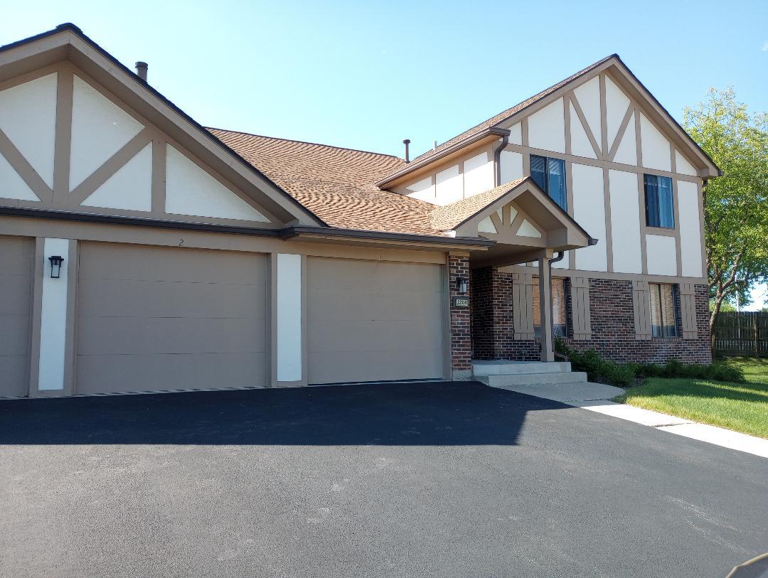 a front view of a house with yard