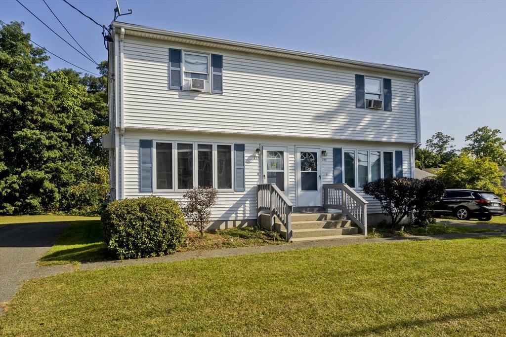 a view of house with outdoor space and porch