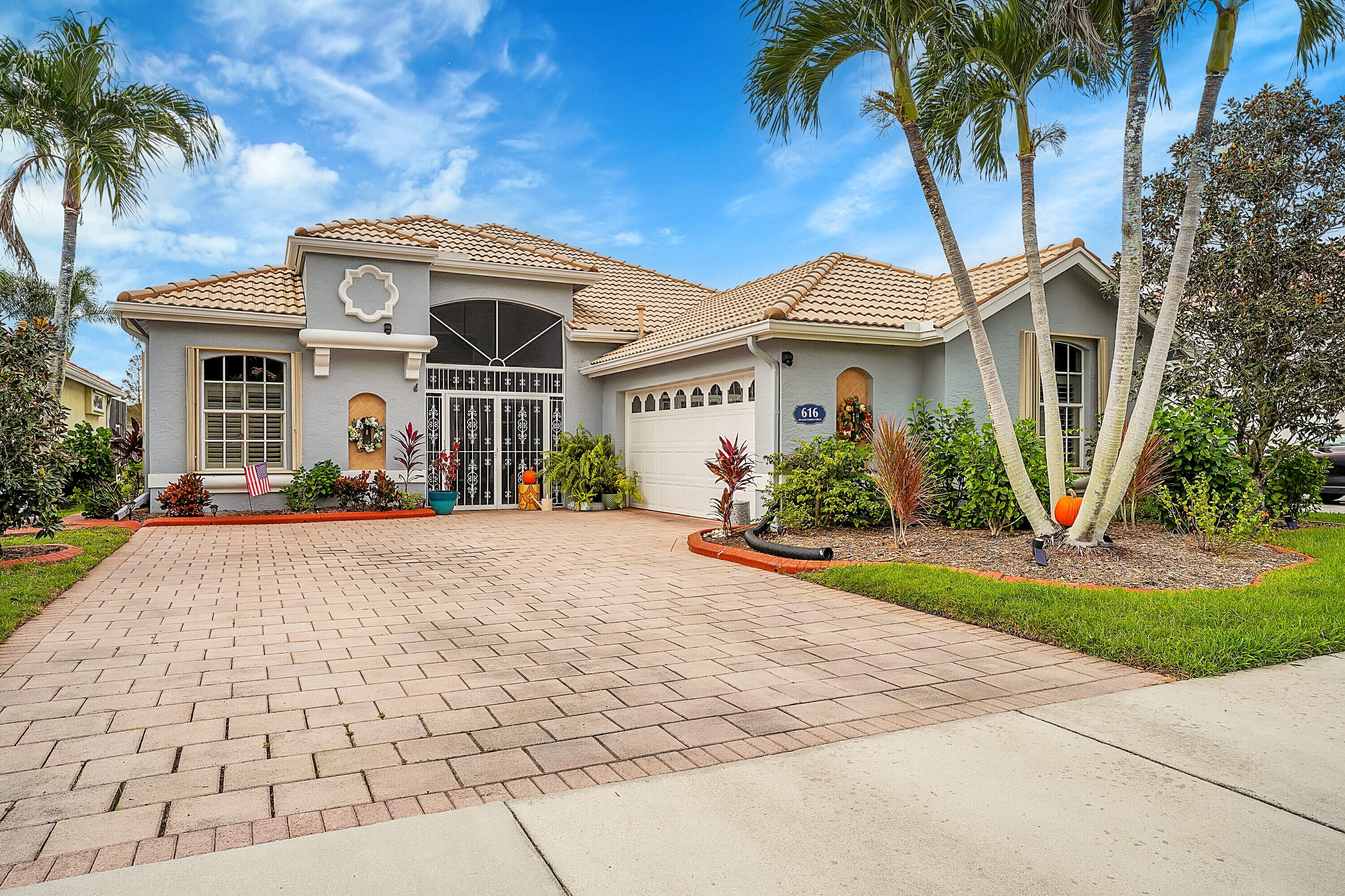 a front view of a house with garden