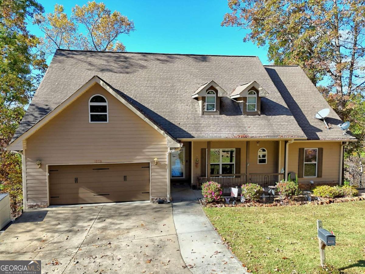 a front view of a house with yard