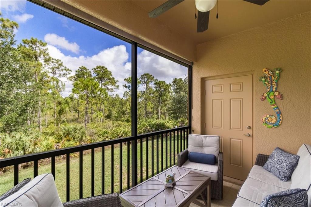 a view of a balcony with furniture