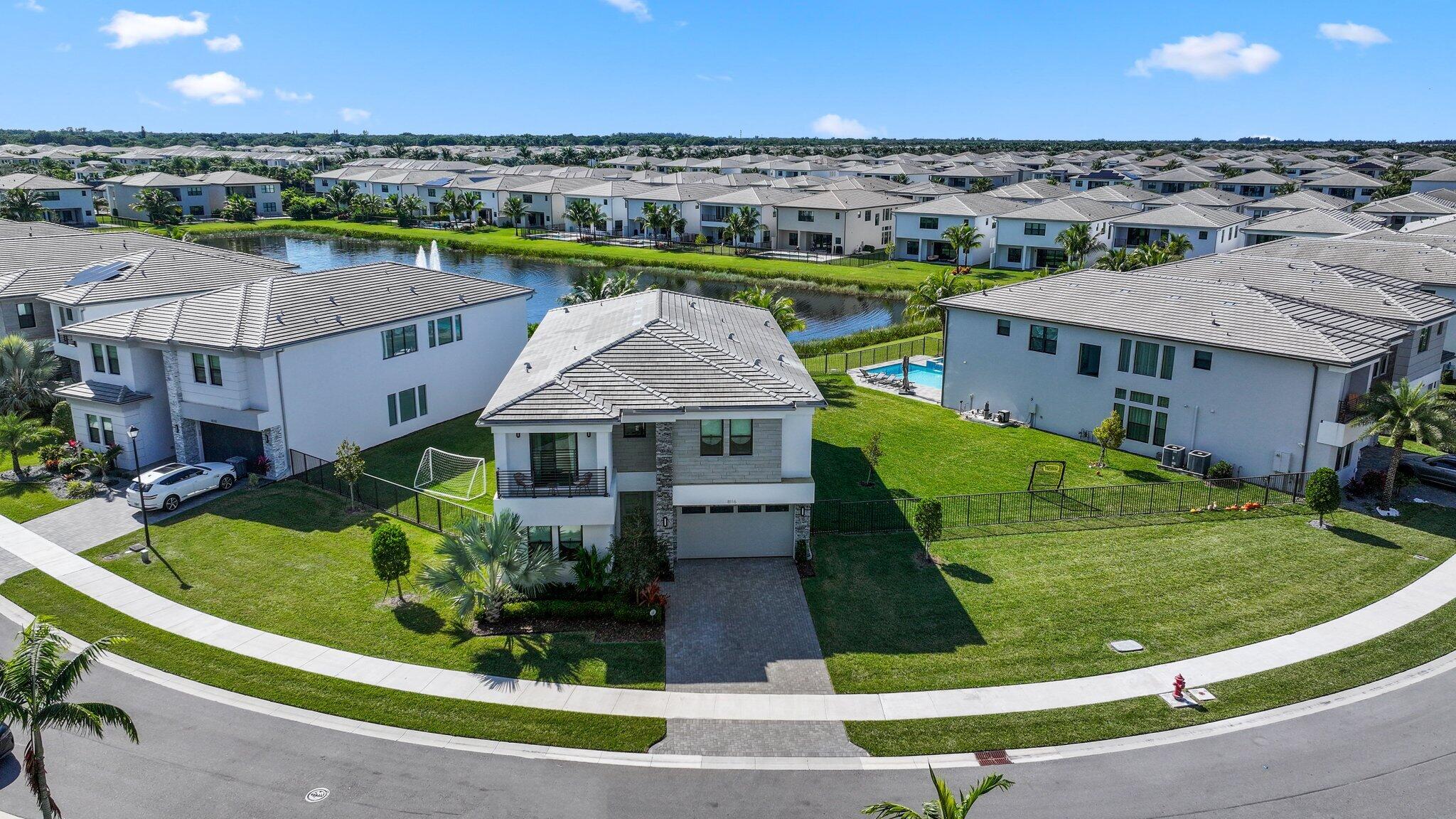 an aerial view of a house with a garden