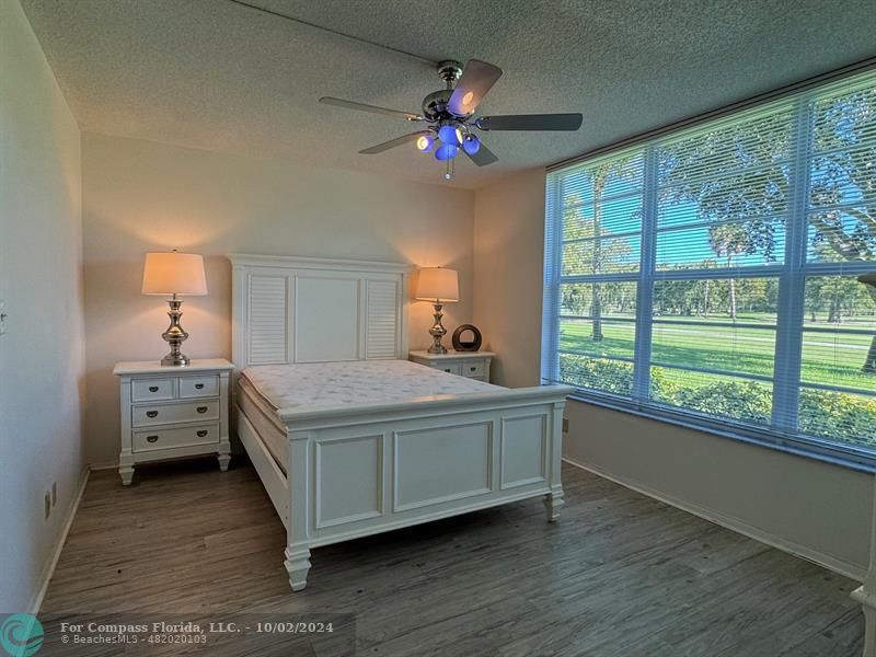 a bed room with a bed and a window