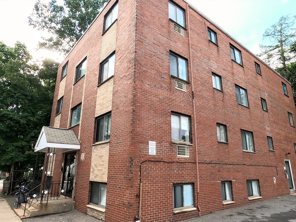 a bricked building with multiple windows