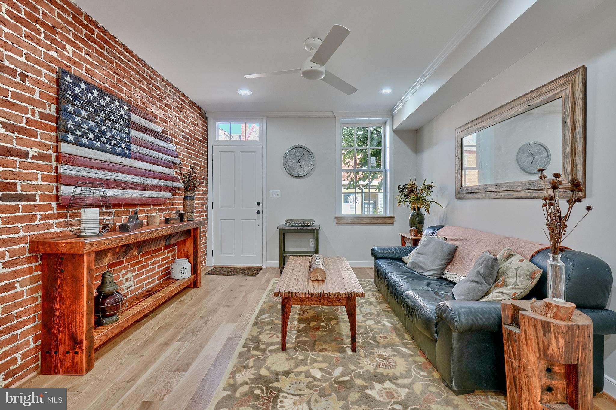 a living room with furniture and a clock