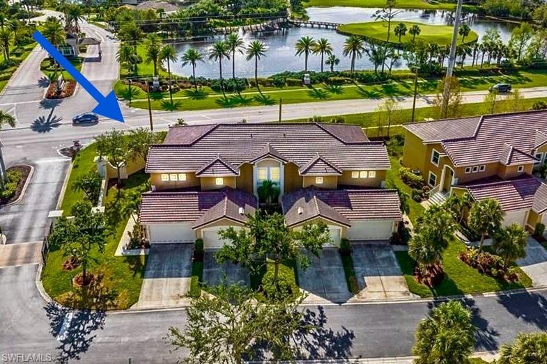 an aerial view of a house with a yard outdoor seating and entertaining space