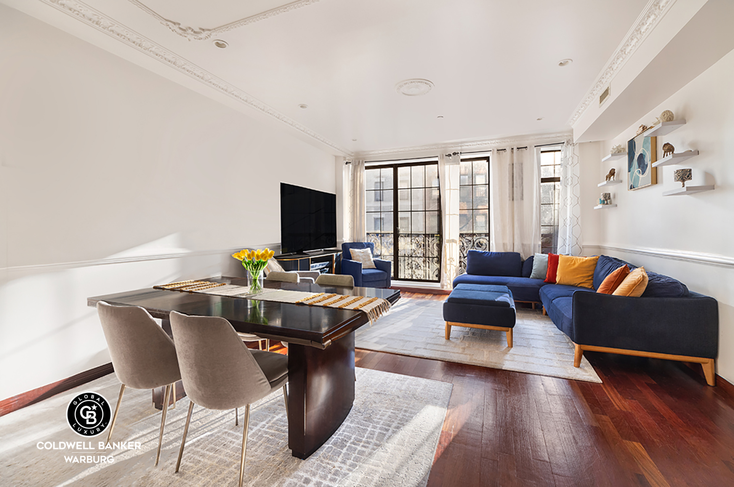 a living room with furniture and a flat screen tv