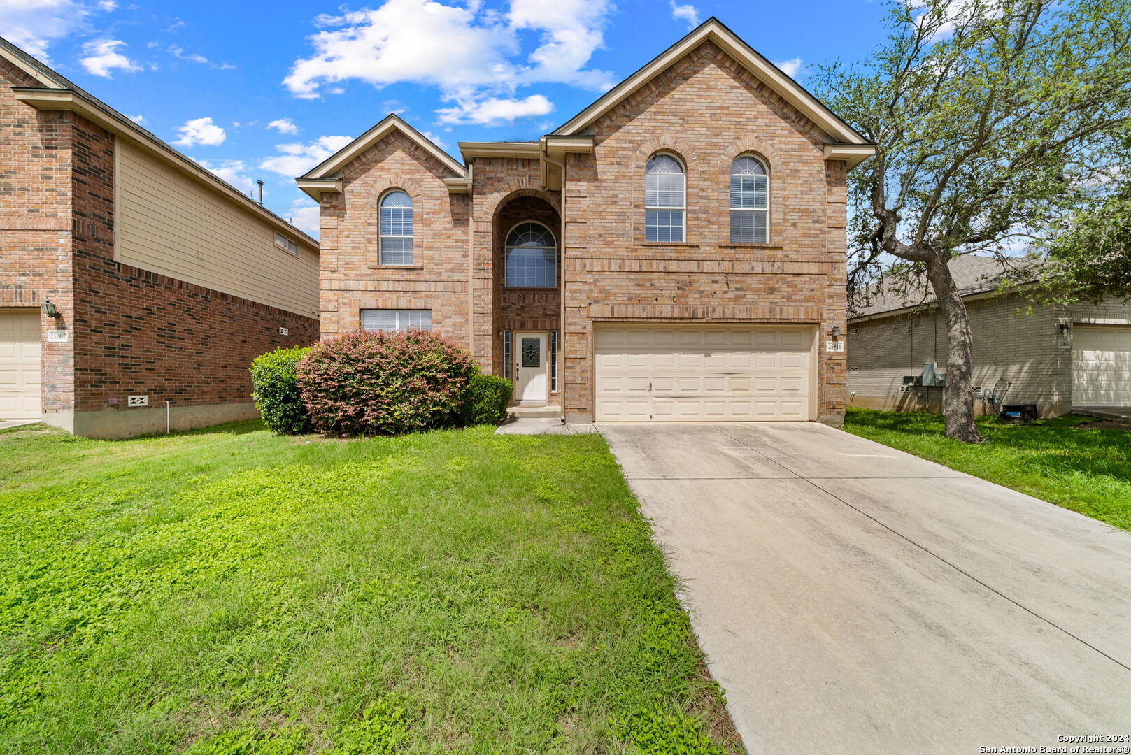 a front view of a house with a yard