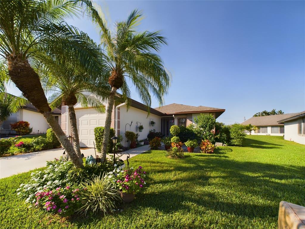 a front view of a house with garden