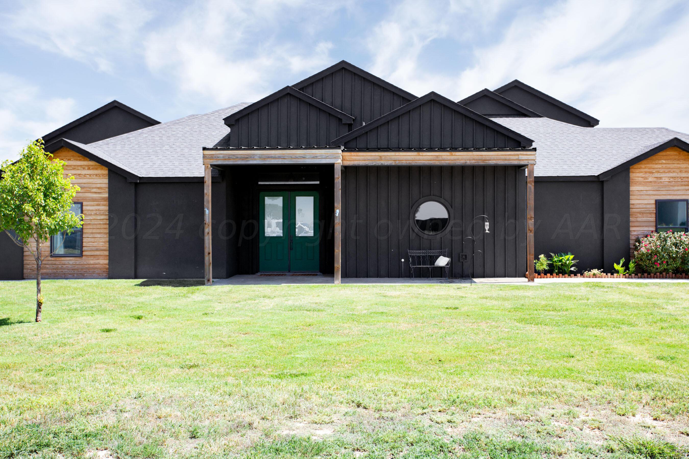 a house with yard in front of it